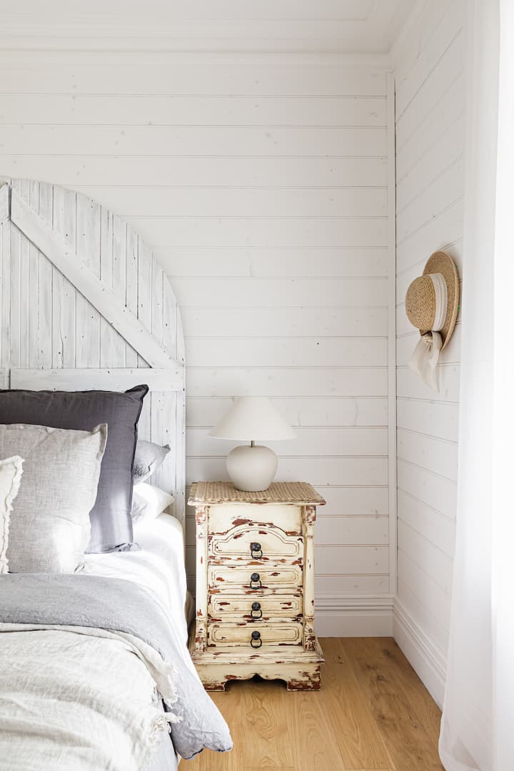 The guest bedroom catching the last light of the day.