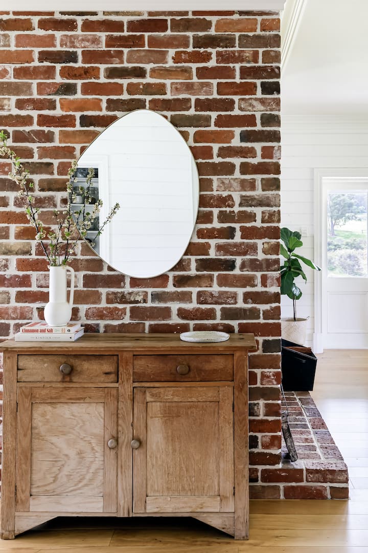 The brick pillar is the centrepiece of the living areas.