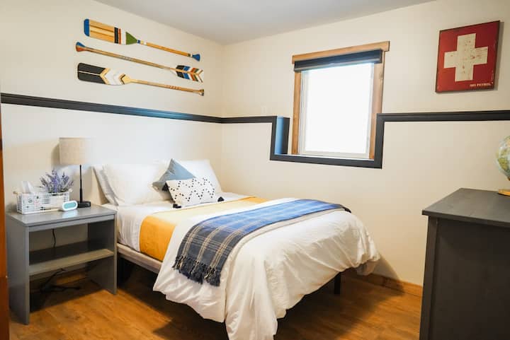Bedroom with full size bed and twin size bunk beds