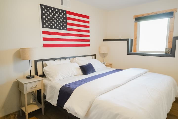Bedroom with king size bed and smart TV