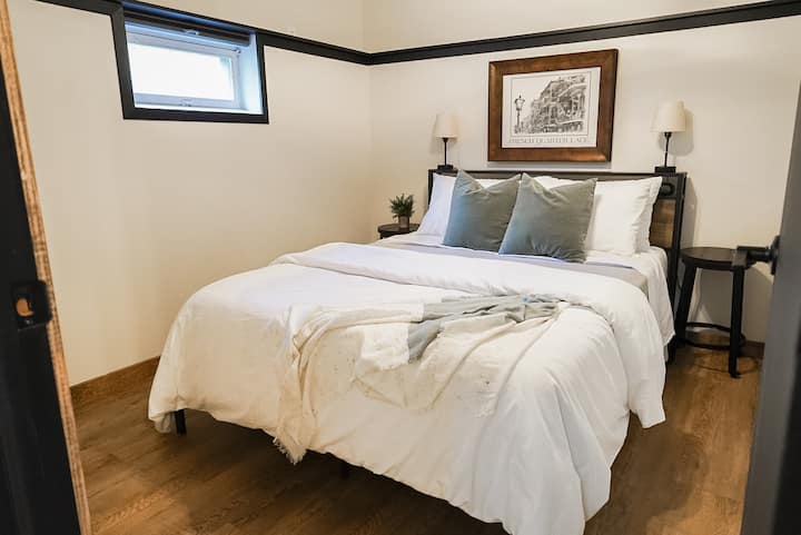 Bedroom with queen size bed and smart TV
