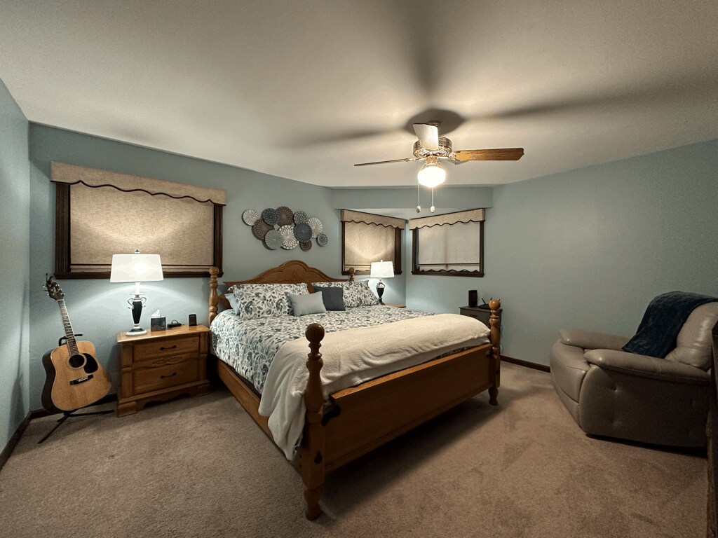 Primary Bedroom Suite (King Bed), Nightstands and Lamps, Recliner, and walk-in Closet