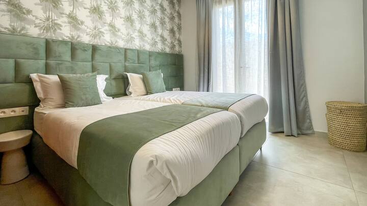 This is the first bedroom when entering Villa AMELIA, which is composed of two single beds.