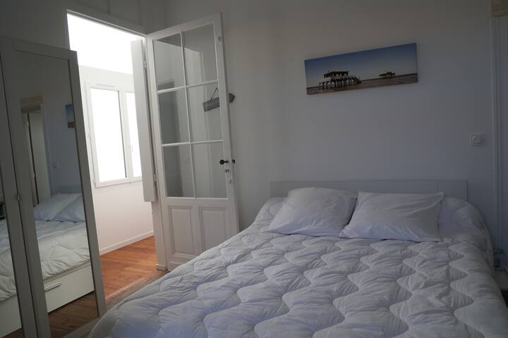 bed in the master suite with shower, sink and direct access to the terrace