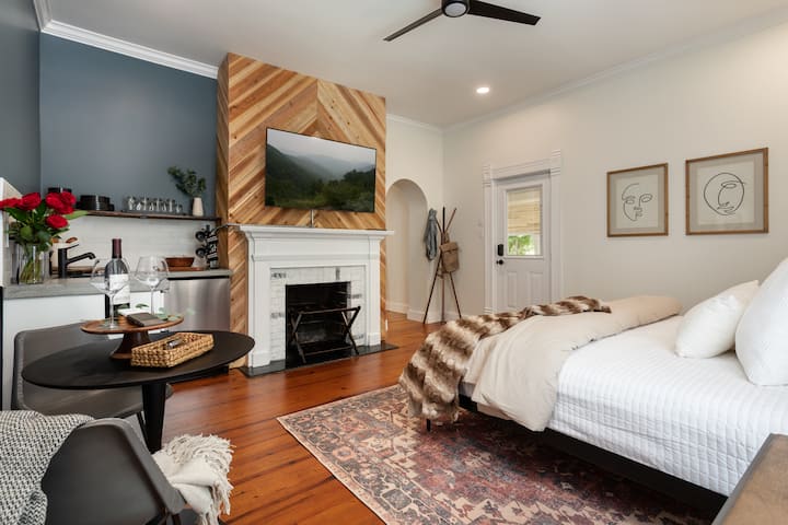 Unwind in style in your chic main floor Primary Bedroom, boasting a coffee , flat screen, and all the necessary comforts for a luxurious stay.