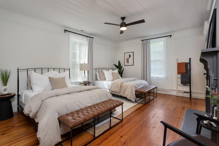 Upstairs bedroom with two Queen beds. Room equipped with noise machine & luxury linens.