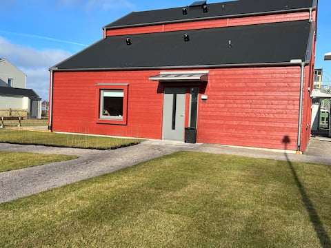 Semi-detached apartment with patio