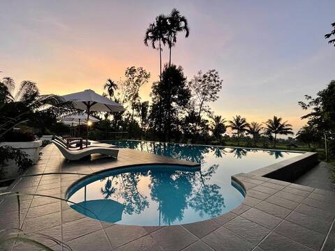 Twin bed pool view at Nirvana
