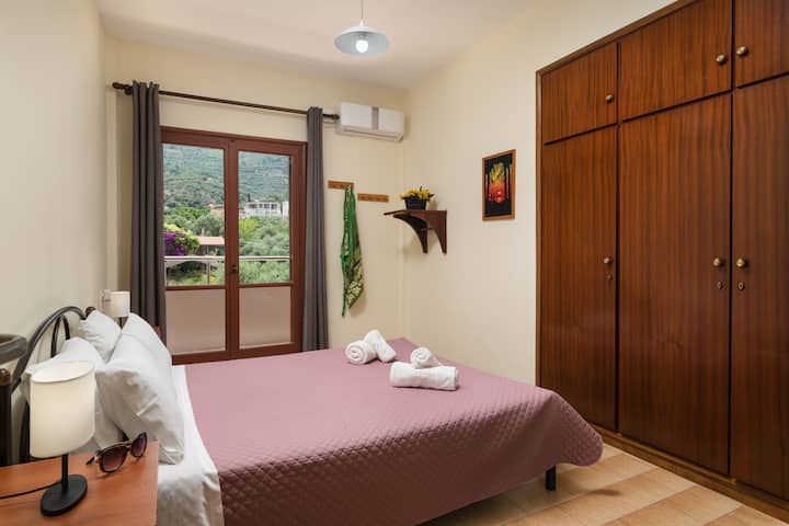 Bedroom 2, balcony door, double bed.