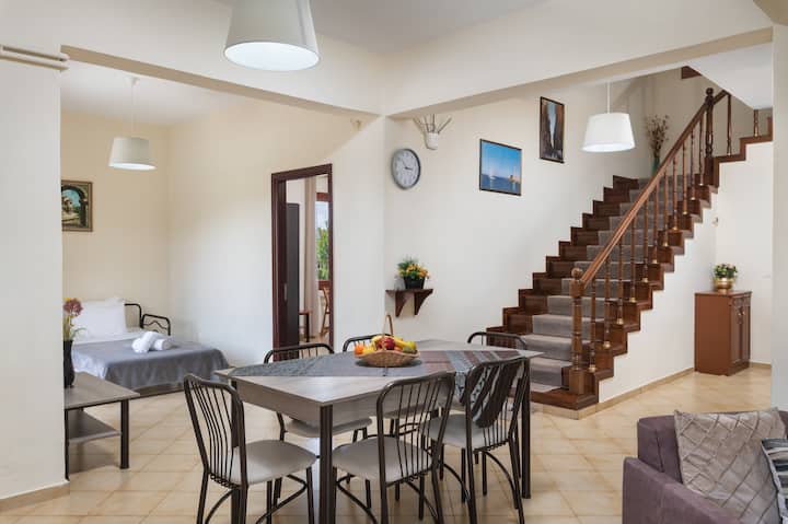 Dining table and wood stairs.