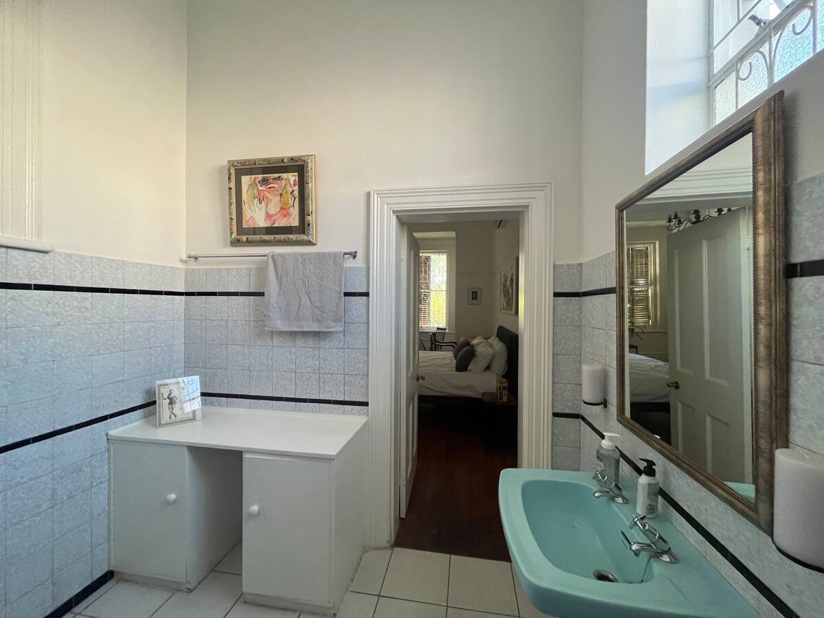 En-suite bathroom and doorway to the king en-suite room at Utopia co-living Cape Town