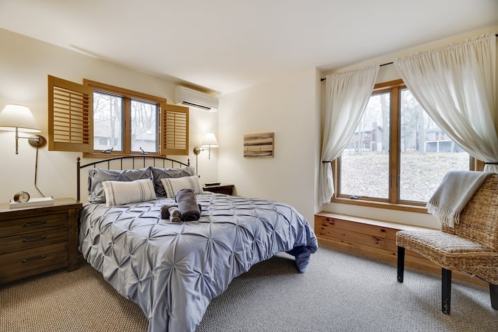 Queen bed in downstairs bedroom with oversized closet and room for a home office