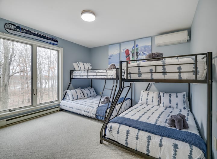 Twin over full bunk bed room includes a 40” HDTV with retro Nintendo.  Even the kids can wake up to lake views.