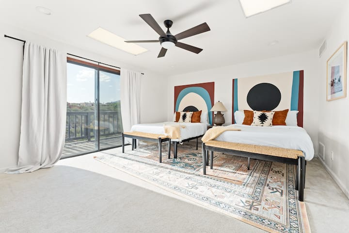 Two queen beds upstairs with balcony. 