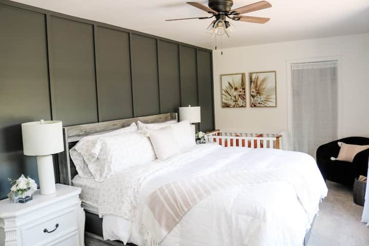 King bed (with crib) in bedroom #1 on main floor
