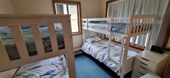 Four beds in here. bottom 2 beds have adult mattresses. Top two will be comfortable for children up to 14 years.
