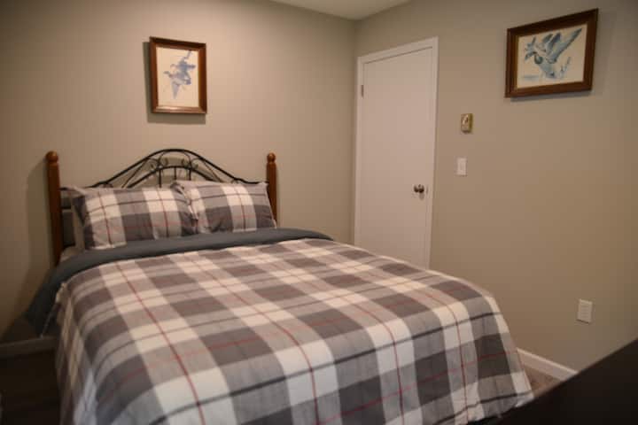 Guest bedroom with full size bed.