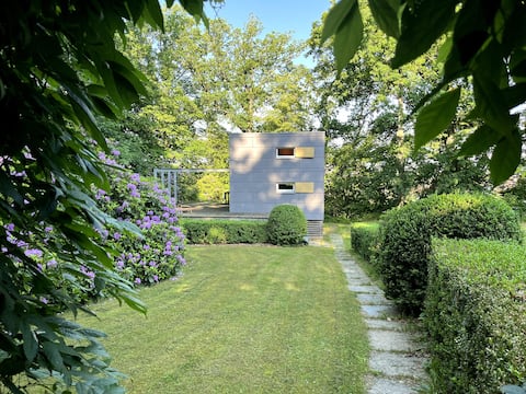 Three cottages in idyllic garden landscape