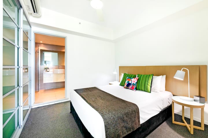The hotel-style first bedroom features a queen-sized bed plus plenty of wardrobe space to store your things.
