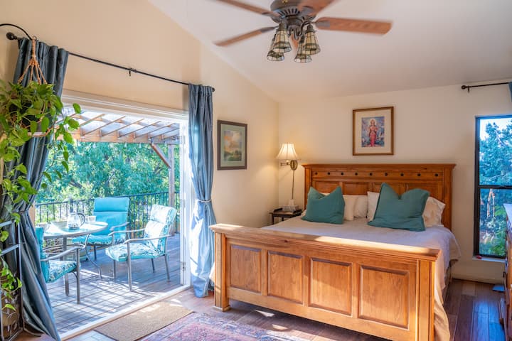 Master bedroom with private deck entrance, fireplace, walk-in closet, and en-suite four piece bathroom.