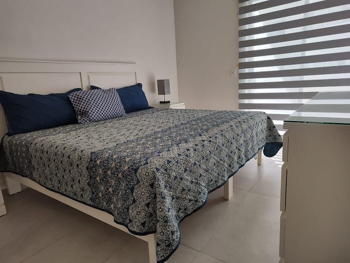 Master bedroom with a ensuite bathroom and a safe.