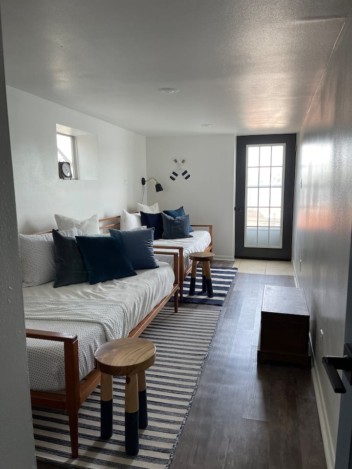 Bedroom 3  with two twin beds with exterior door directly facing the lake. (Lower Level)
Walk right outside to the pier and try to catch your breakfast early. 