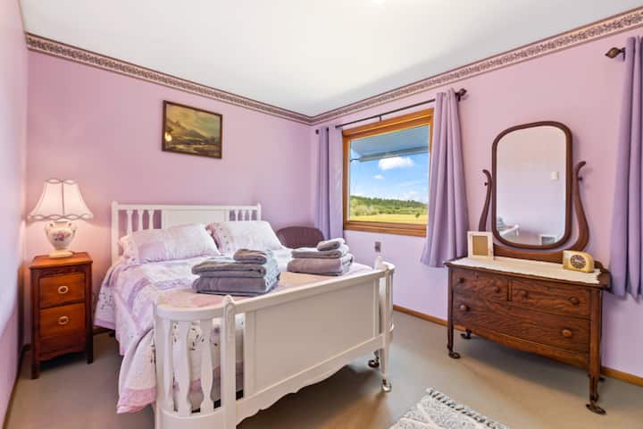 Full size antique bed (new mattress and exquisite bedding) and two windows with views