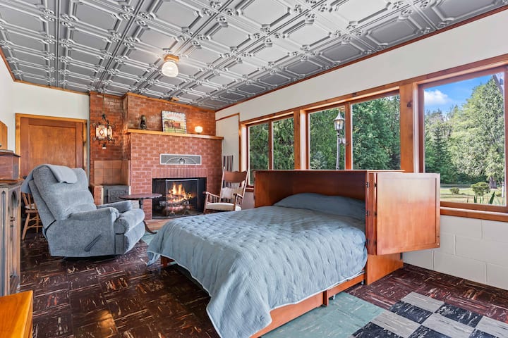 Queen sized Murphy bed made up in the recreation room