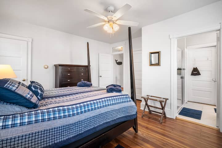 Sail into dreams in this tranquil bedroom, a blend of nautical charm and homely comfort, moments from the sea.