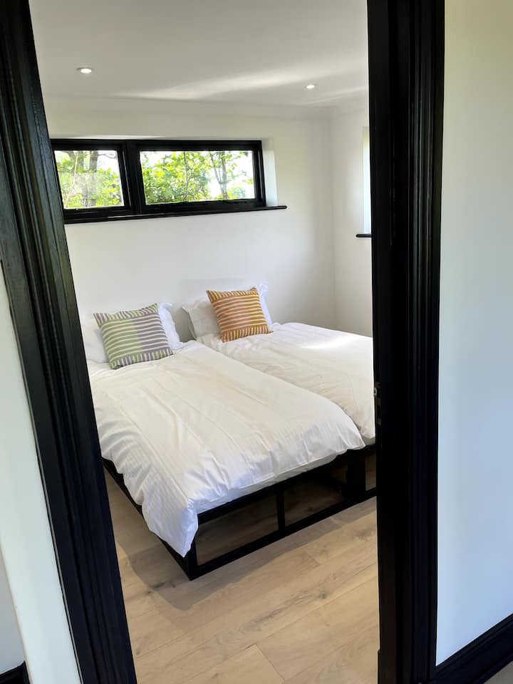 Second bedroom.  Two single beds complete with Egyptian cotton linen, feather pillows.