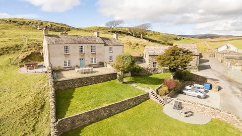 Farmhouse with views, hot tub, sauna & games room.