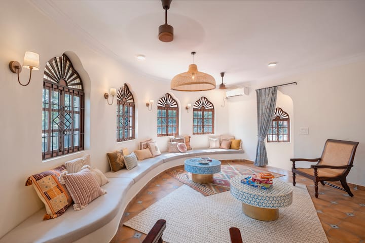 Well ventilated Sitting area with lots of throw cushions