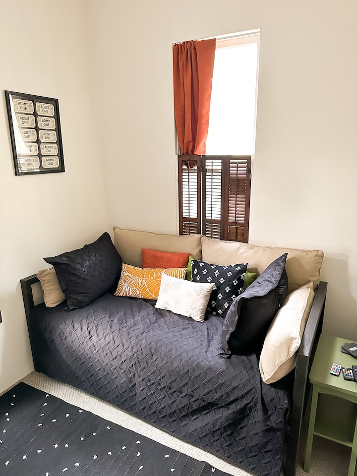 This is our media room/2nd bedroom with a TV and a twin daybed.