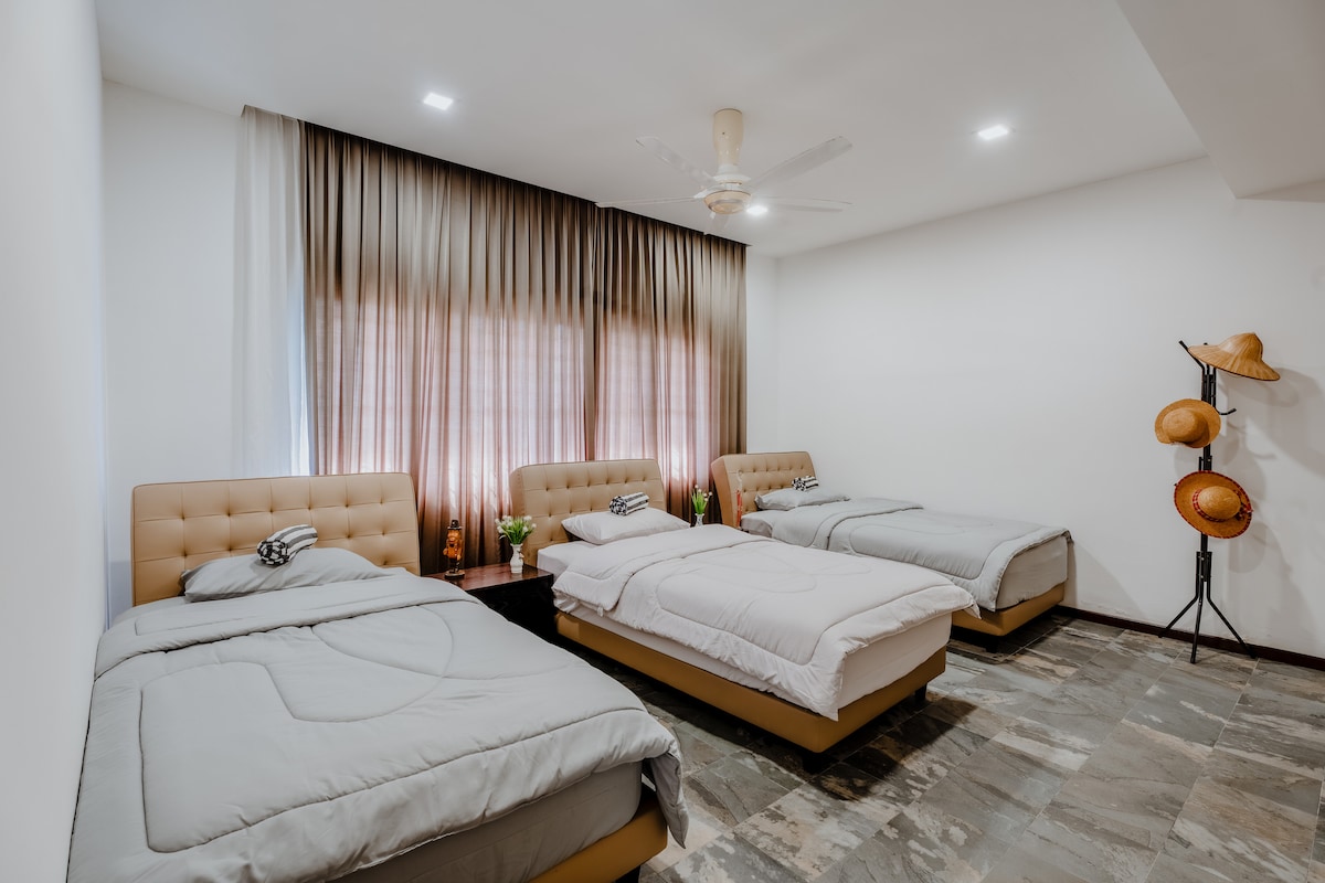 Room 4 - comes with 3 small double bed, fan and air conditioner