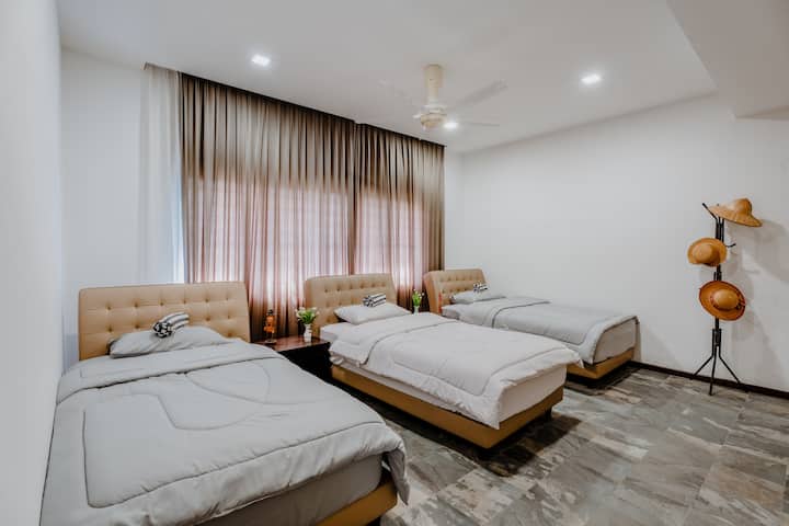Room 4 - comes with 3 small double bed, fan and air conditioner