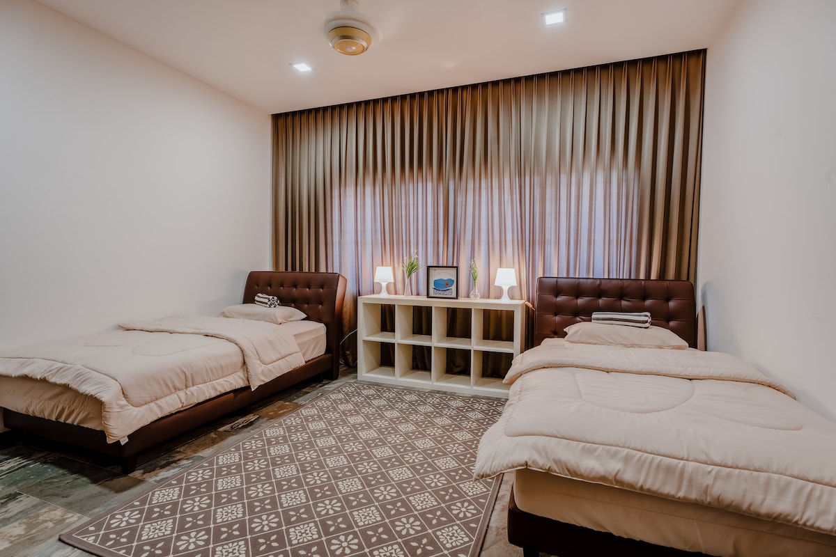 Room 2 - comes with 2 small double bed, fan and air conditioner