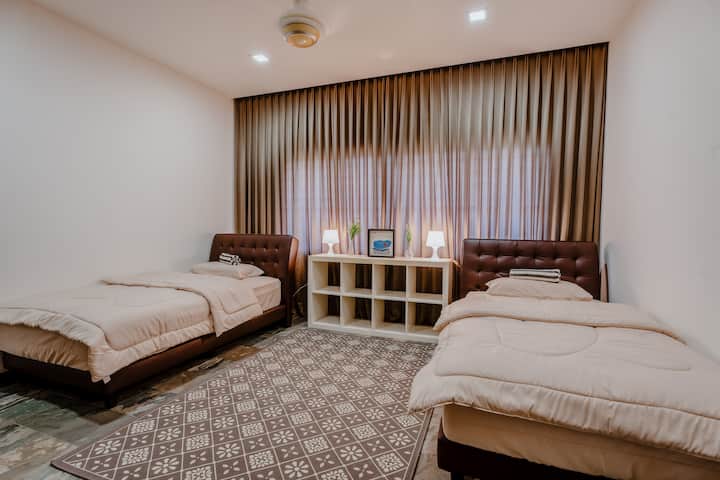 Room 2 - comes with 2 small double bed, fan and air conditioner