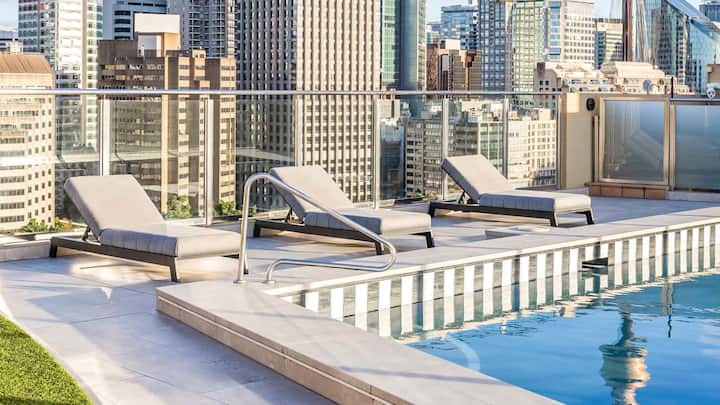 Relax next to the newly renovated pool with city views.