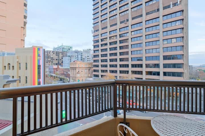 Look out over the world famous Oxford Street from your balcony with a drink.