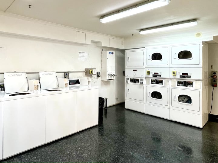 Shared laundry space with modern coin/card operated washing machines & dryers. (24hr access)