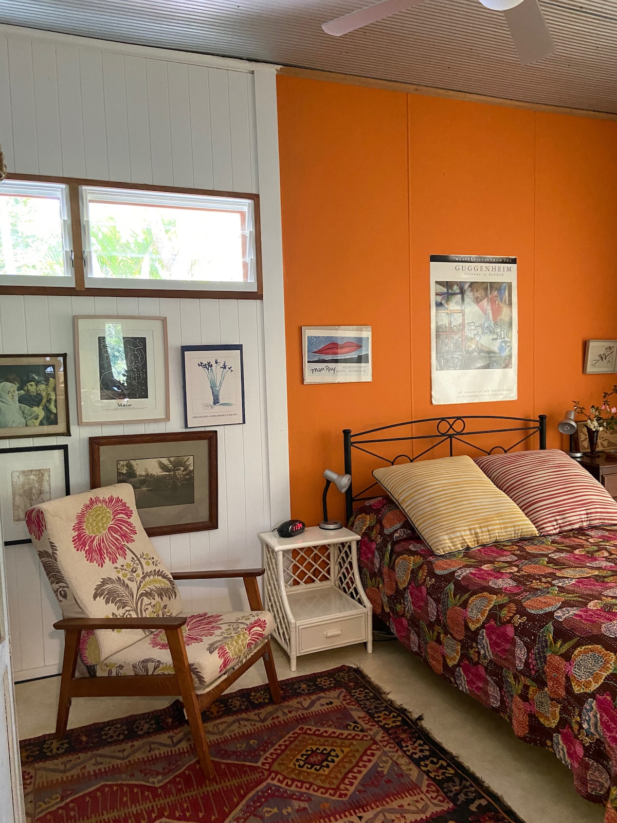 second bedroom with bedside lamps and clock