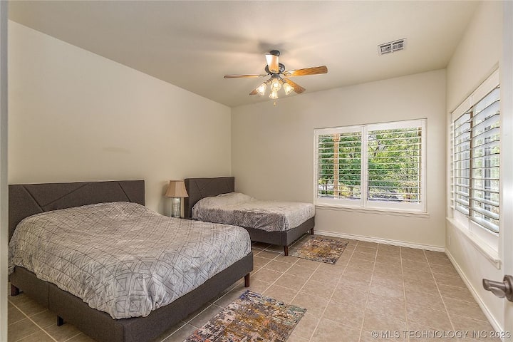 Main House Downstairs 4th Bedroom with two double beds and an ensuite bathroom