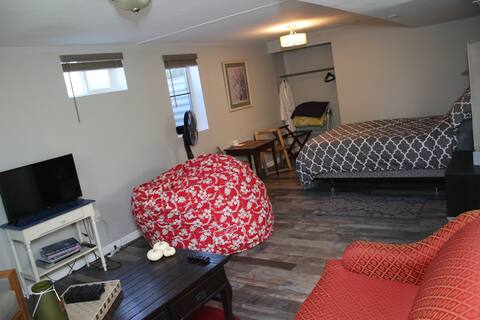 Private garden level basement studio apartment.