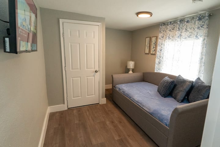 Living-room - a comfortable area to hang out and watch your favorite movies, shows, or sports!  
