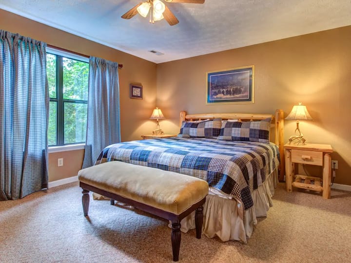 comfortable king bed in bedroom on main living level