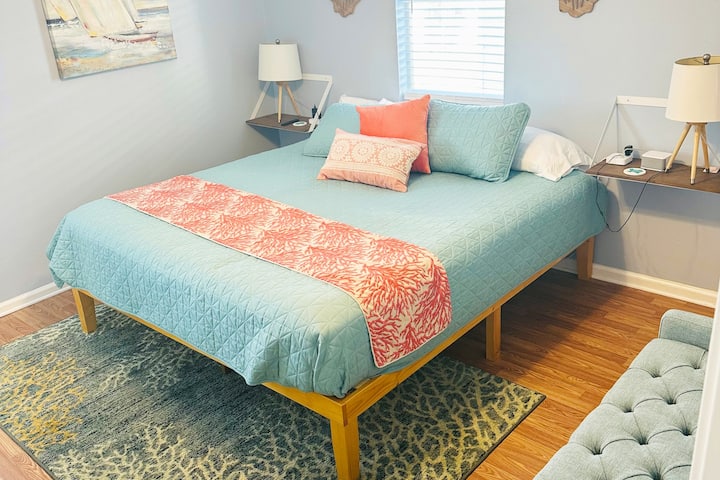 Master bedroom with NEW king hybrid mattress.  En-suite bathroom has combo tub/shower and single vanity.  Full length mirror, 2 floating nightstands and bench provided for luggage. 42" Smart TV offers free YouTube TV.