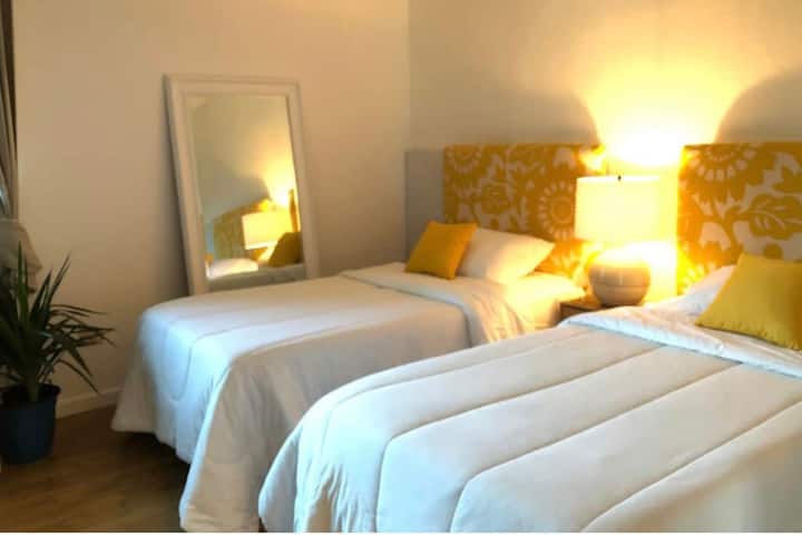 2 twin size beds. This bedroom has its own TV.
