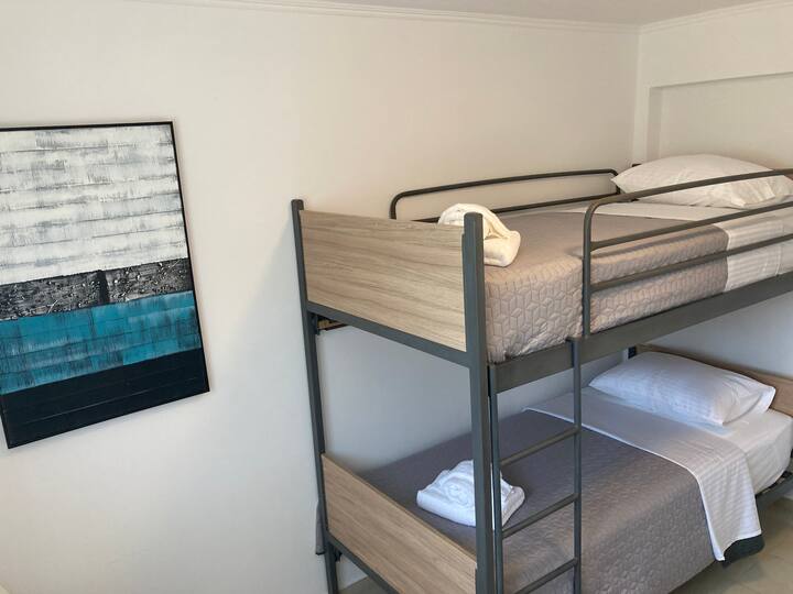 Room 3 - Featuring a cozy bunk bed with premium Sealy mattresses. Each 90x200cm.