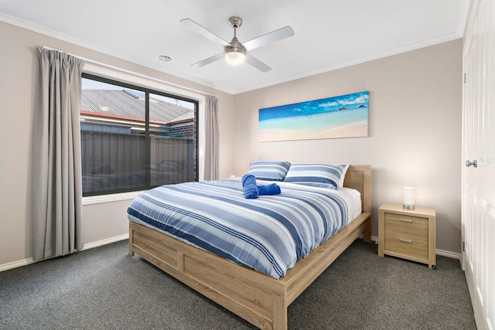 King size bed, robes, block out curtains, and ceiling fan