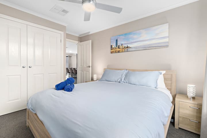 King size bed, robes, block out curtains, and ceiling fan